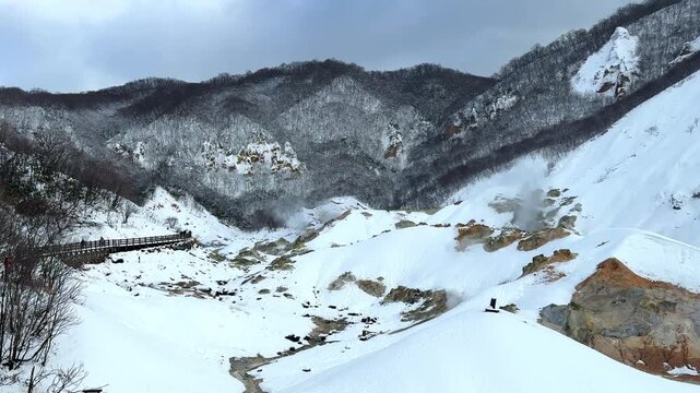 Scenic view of Jigokudani Hell Valley Volcano in winter, Noboribetsu , Hokkaido
