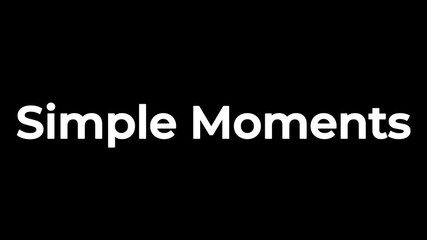 Striking white text displaying the phrase simple moments in a bold typeface against a solid black background creating strong contrast for clarity.