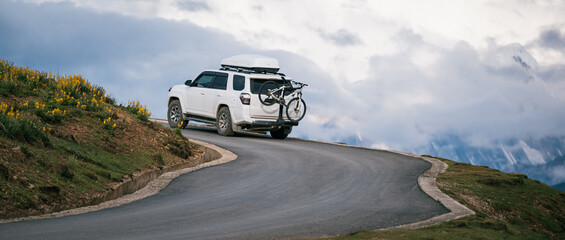 Driving off road car on the high altitude mountains