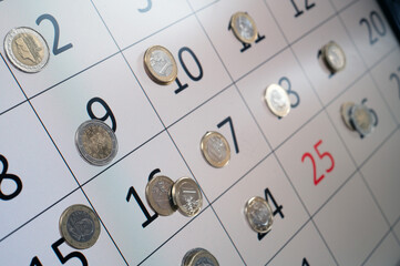 Calendar With Coins And Red Date Highlight Showcasing Finance, Budgeting, And Daily Money Planning For Projects