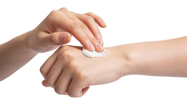 Hands Applying Cream to Arm for Skincare on White