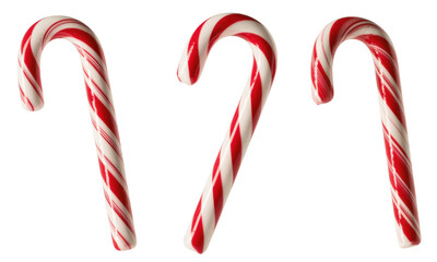 Red and white striped candy canes on black red and white stripes isolated on a transparent background