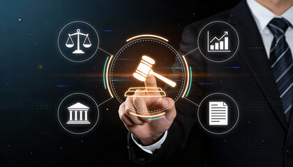 Businessman hand touching digital gavel icon for online legal services and judicial technology concept with holographic symbols of scales courtroom document and financial chart