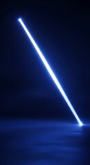 Bright electric blue light beam shines diagonally across a dark, reflective surface