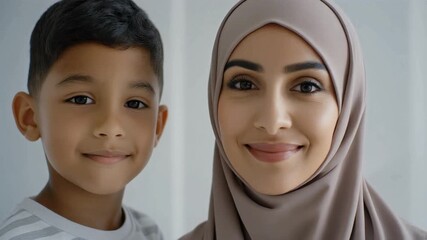 A heartwarming moment between a mother and son outdoors with a soft serene atmosphere.