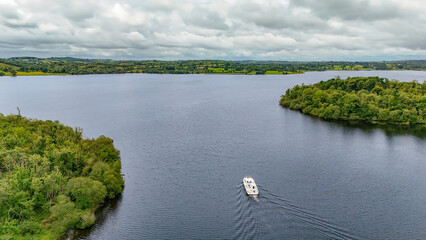 Aerial drone view of vacation motor boat in river Shannon from above, family travel by motorboat, Ireland 