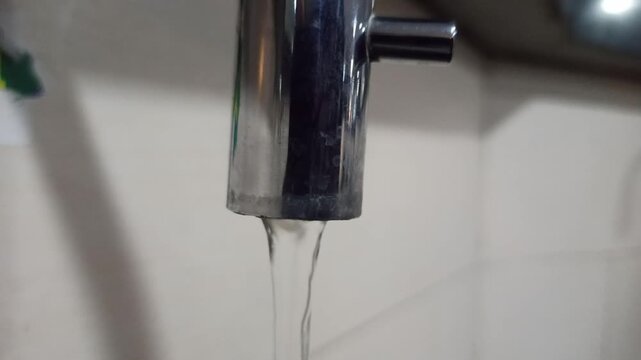 A well-designed water tap at a mosque, clean and sturdy, providing comfort for ablution with a neat layout and a calm spiritual atmosphere.