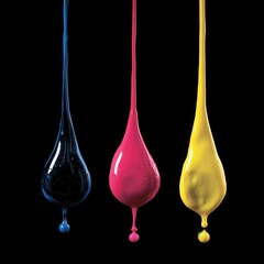 Dripping CMYK colors against black background