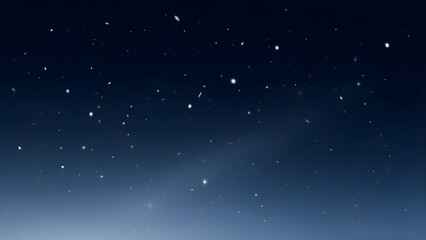 Fototapeta premium Delicate snowflakes drift against a deep, dark blue night sky background.
