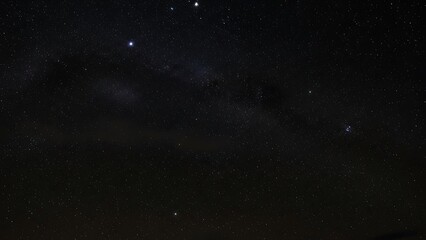 Fototapeta premium Starry night sky with milky way and clouds stars astronomy