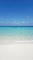 Fototapeta premium A long, pristine stretch of white sand meets the turquoise ocean water under a clear blue sky, emphasizing tranquil solitude and distance ,natural ,wave ,ocean