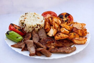 Grilled Meat and Rice Platter with Tomatoes and Vegetables - Arabic Cuisine Food Photography Featuring Lamb and Beef