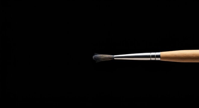 Close-up showing the fine bristles and wooden handle of a specialized, professional tool used for detailed painting and artistic creation ,wood ,specialized ,tool - Powered by Adobe
