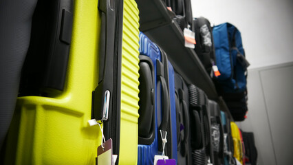 A large assortment of different suitcases on a retail display