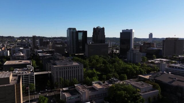 Wide aerial establishing moving from BJCC district into downtown Birmingham and interstate 20, panoramic pullback