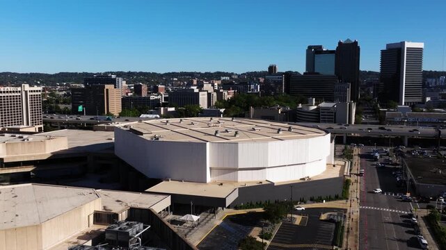 Smooth aerial orbit over Birmingham Jefferson Convention Complex highlighting scale and urban setting against skyscrapers