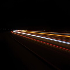 Glowing streaks of light captured during a long exposure in darkness, forming a dynamic, ethereal, and colorful abstract background texture ,speed ,future ,black