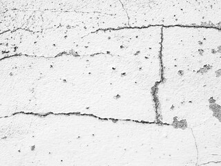 Fototapeta premium Crack wall texture background broken earthquake effect, whtie grey building cement damage pattern plaster grunge black line paint surface abstract, construction rough street concrete backdrop.