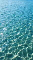 A bright sun illuminates clear blue water with gentle waves creating shimmering patterns perfect for a refreshing summer day at the beach ,horizontal ,transparent ,texture