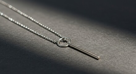 A close-up view highlighting the intricate links of a sterling silver chain necklace adorned with a minimalist polished metal pendant design ,delicate ,beauty ,clasp