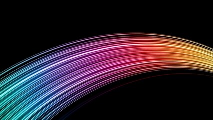 Vibrant rainbow light trails in motion on black background