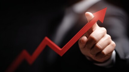 Businessman holding a red upward arrow symbolizing growth, success, and financial progress in a modern corporate environment