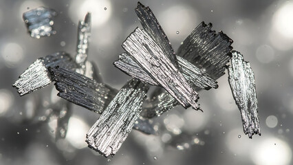 Abstract Macro Shot of Shimmering Graphite Flakes in Liquid