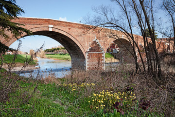 Cesena, Emilia Romagna, Italy: the ancient brick arch bridge Ponte Vecchio over the Savio river, historical architecture landmark