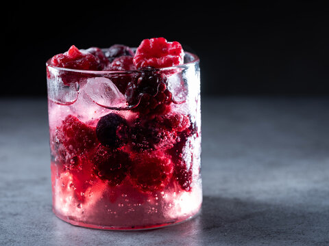 Raspberry and blueberry drink in a cup