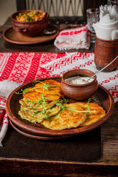 Enjoy a plate of warm, crispy flatbreads served with a flavorful dipping sauce, perfect for sharing