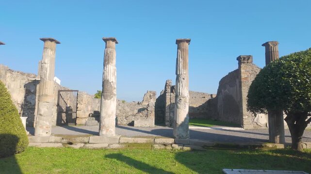 Pompeii's Temple of Apollo showcases standing columns and foundation of important Roman religious site frozen in time at archaeological park