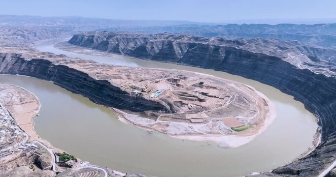 Aerial time-lapse of Panlong Bay (formerly Fusi Bay), a dramatic meander of the Yellow River in Shaanxi Province, China &mdash; located within a protected national park area on the Loess Plateau.
