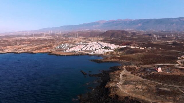 Abades village and windmills at dawn on Arico's volcanic coast
