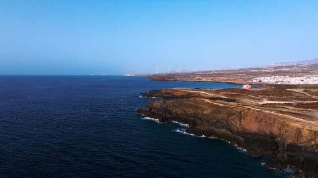 Breathtaking volcanic coast at dawn near Abades under clear skies
