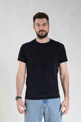 Handsome Caucasian 35 years old man in black T-shirt with neutral facial expression.