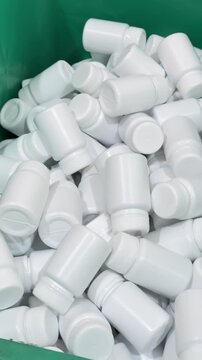 White Plastic Bottles Collected in Container for Packaging and Manufacturing Industry