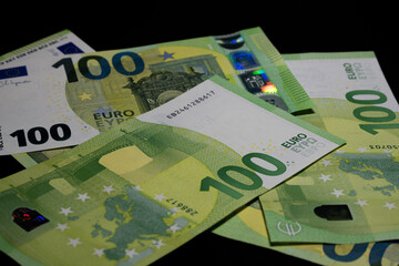 Euro banknotes scattered as money background