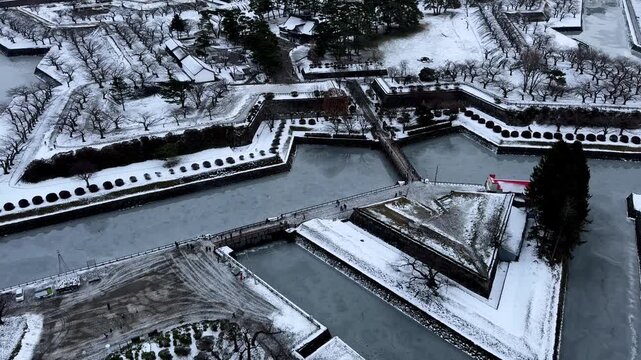 Snowy historic fort and geometric moat seen from above