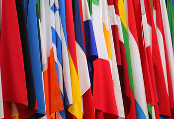 background of dozens colored flags from european states