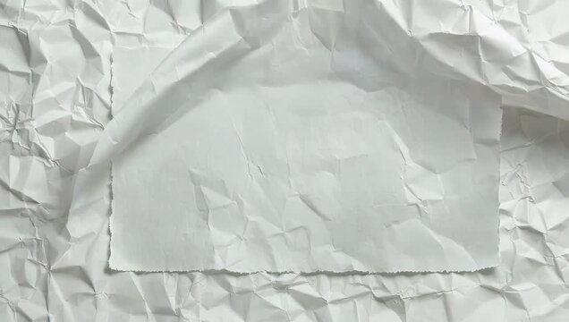 Seamless looping 4K stop motion animation of white crumpled paper texture creating clean minimalist background suitable design overlays presentations abstract 