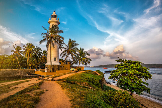 Beautiful fort Galle and white lighthouse on Sri Lanka at sunset