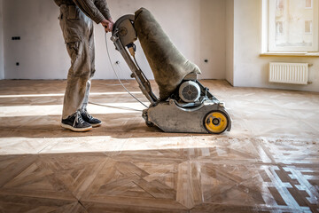 Parquet floor renovation with industrial sanding grinding polishing machine