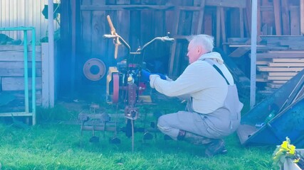 Nostalgic afternoon repairing antique engine in yard