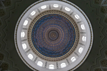 Dome of an Islamic Mosque: Blue-and-Gold Geometric Patterns Framing Skylights