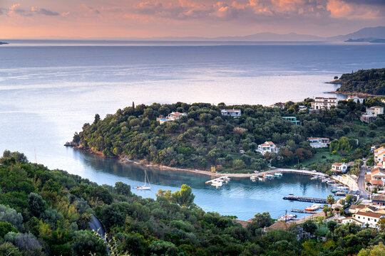 Aerial view village of Agios Stefanos with houses on green and mountainous island Corfu. The most beautiful bays in Europe, Ionian Sea, Greece.