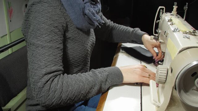 Seamstress prepares fabric for further sewing. Concept of showing skillful female specialists hard work and highlighting proficiency of master