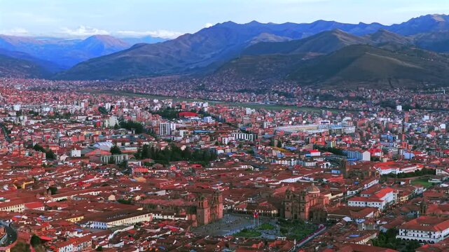 Cusco Cuzco Alejandro Velasco Astete International Airport Peru Per&uacute; cityscape red buildings Peruvian Andes landscape aerial drone rainy season sunny sunset clouds Inca Empire capitol backwards