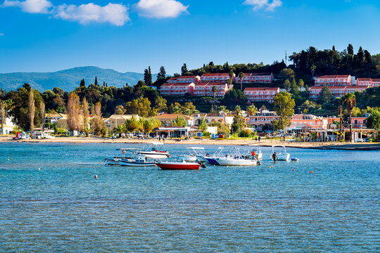 View on Sidari beach with tourist resort and boats on green holiday island Corfu. The most beautiful beaches in Greece.