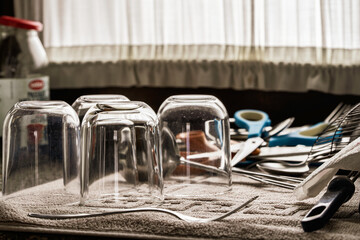Clean glassware drying on a domestic kitchen counter