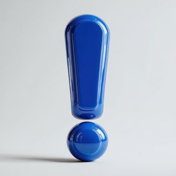 Vibrant blue exclamation point sculpture with reflective surface in contemporary studio design